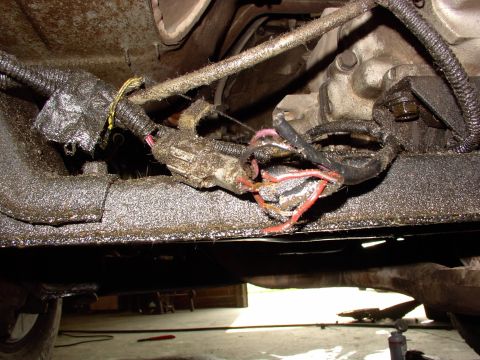 1988 Ford C-350 (Centurion Conversions) - Damaged wiring harness with exposed wires, likely needing repair or replacement.