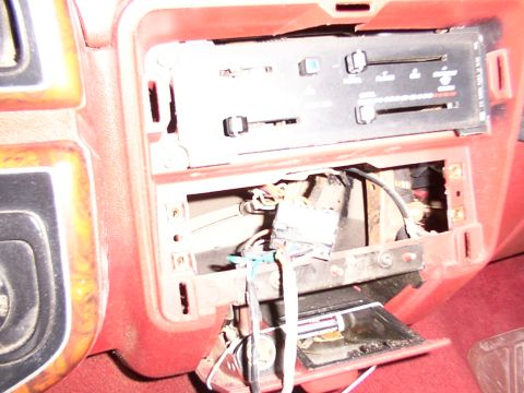 1988 Ford C-350 (Centurion Conversions) - The dashboard shows exposed wiring and climate controls, indicating a radio installation or removal.
