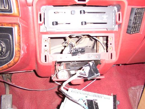 1988 Ford C-350 (Centurion Conversions) - The dashboard interior shows the area where a radio was removed, exposing wiring and HVAC controls.