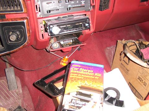 1988 Ford C-350 (Centurion Conversions) - Car stereo installation kit and dashboard interior with radio removed.