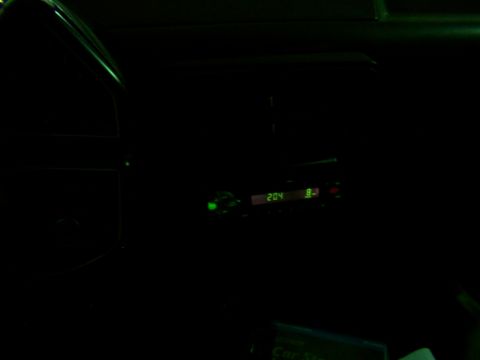1988 Ford C-350 (Centurion Conversions) - The digital display of a car radio shows the time and station.