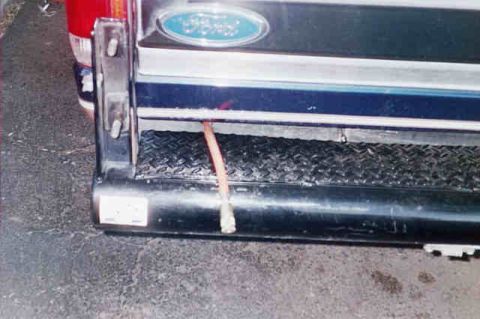 1994 Ford Bronco - rear line out. I put an x in the plastic dam below the tailgate. It works well to hold the line in place.