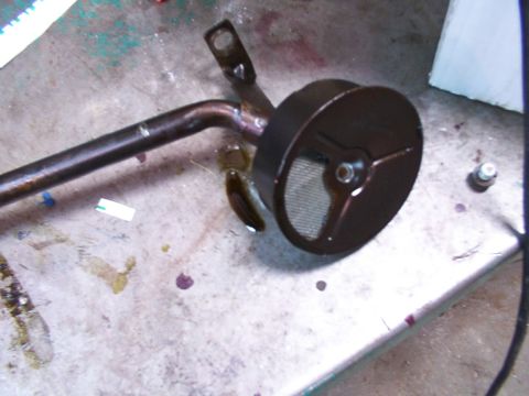 1988 Ford C-350 (Centurion Conversions) - Oil pickup tube with screen, likely from an engine's oil pan.