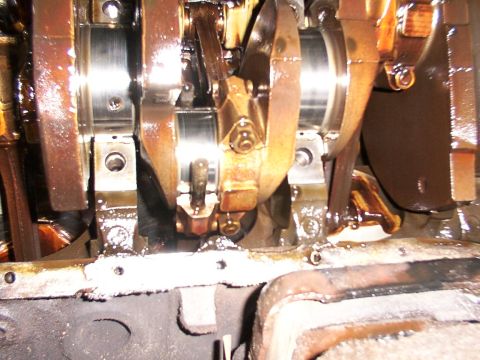 1988 Ford C-350 (Centurion Conversions) - Close-up view of the internal engine components, including the crankshaft and connecting rods.