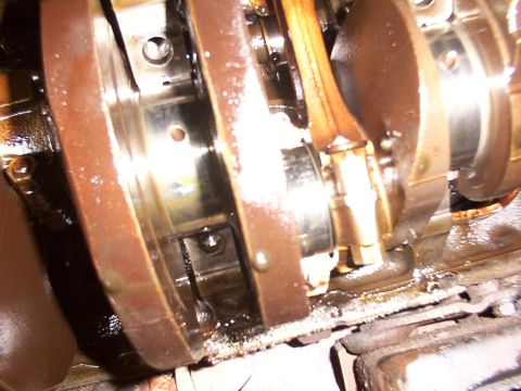 1988 Ford C-350 (Centurion Conversions) - Close-up view of internal engine components, including the crankshaft and connecting rods.