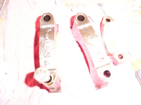 1988 Ford C-350 (Centurion Conversions) - Close-up of an engine component, possibly a bearing cap, with stamped identification numbers.