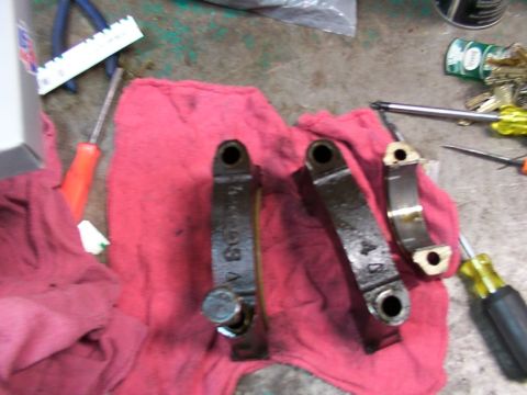 1988 Ford C-350 (Centurion Conversions) - Several engine bearing caps are laid out on a red cloth, with tools scattered around the workspace.