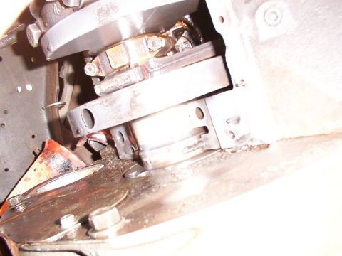 1988 Ford C-350 (Centurion Conversions) - Detail of an engine part, possibly related to a rear main seal, showing mechanical components and wear.