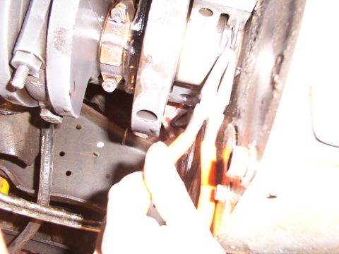 1988 Ford C-350 (Centurion Conversions) - Engine crankshaft and connecting rod assembly, with pliers being used on a part.
