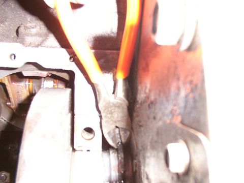 1988 Ford C-350 (Centurion Conversions) - Close-up of engine crankshaft and connecting rod with orange-handled pliers.