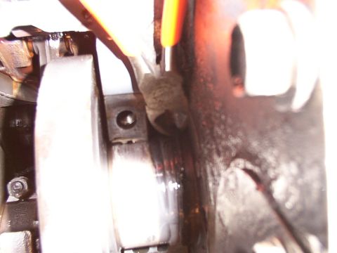 1988 Ford C-350 (Centurion Conversions) - Close-up view of an engine component with a tool engaged.
