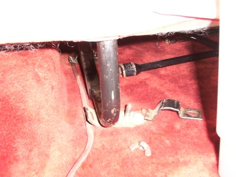 1988 Ford C-350 (Centurion Conversions) - Detail of a vehicle's interior showing a seat mounting bracket and associated hardware on the floor.