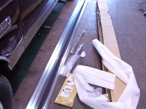 1988 Ford C-350 (Centurion Conversions) - Vehicle running boards and associated parts are shown laid out on a floor.