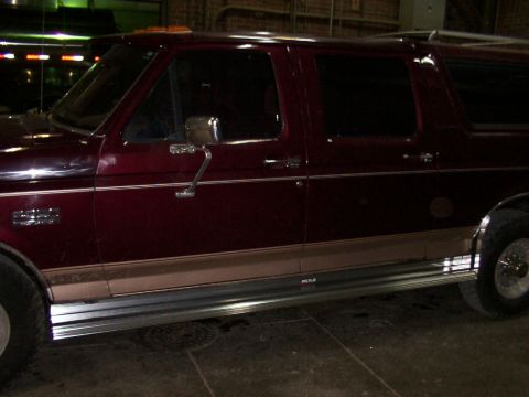 1988 Ford C-350 (Centurion Conversions) - Maroon Ford F-Series truck with Centurion conversion and running boards visible.