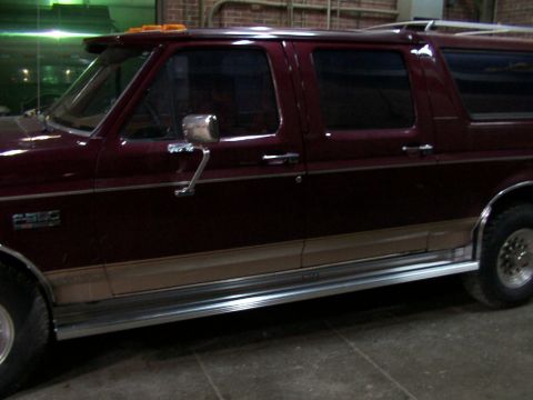 1988 Ford C-350 (Centurion Conversions) - This Ford pickup truck features an extended cab and a two-tone paint scheme with tan lower body trim.