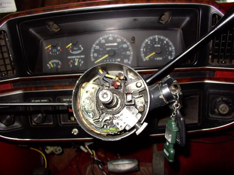 1988 Ford C-350 (Centurion Conversions) - Interior view of a 1988 Ford C-350 (Centurion Conversions) showing the exposed steering column wiring and dashboard gauges.