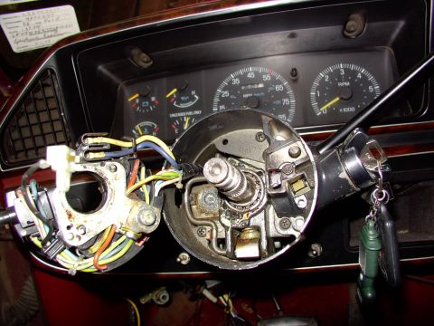 1988 Ford C-350 (Centurion Conversions) - Interior view of a 1988 Ford C-350 (Centurion Conversions) steering column, showing exposed wiring and dashboard gauges.