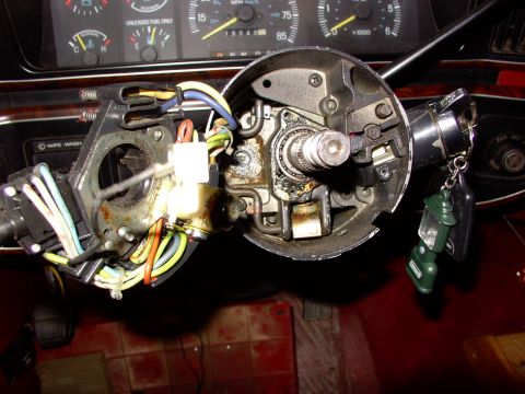 1988 Ford C-350 (Centurion Conversions) - Close-up of a disassembled steering column assembly, showing internal components and wiring.