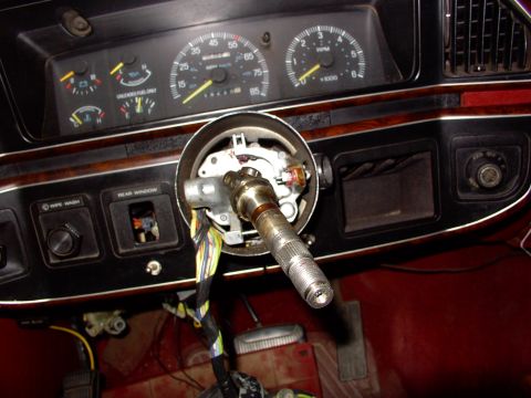 1988 Ford C-350 (Centurion Conversions) - The steering column of a 1988 Ford C-350 (Centurion Conversions) is visible, with the dashboard and gauges in the background.