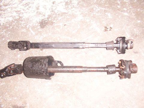 1988 Ford C-350 (Centurion Conversions) - Comparison of two steering shafts, one appearing new and the other heavily used and dirty.