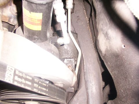 1988 Ford C-350 (Centurion Conversions) - Close-up view of the steering sector and a Micro-V belt on a vehicle.