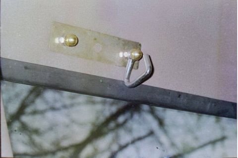 1994 Ford Bronco - inside of sideloader mounts. Used the extra bolt to mount these hooks.