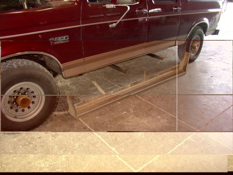 1988 Ford C-350 (Centurion Conversions) - Side view of a maroon SUV, running boards and an F250 badge visible on the fender.