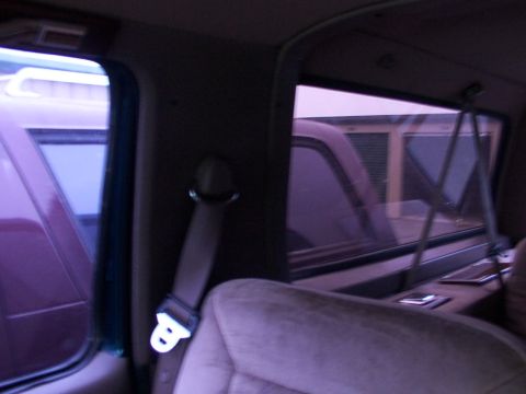 1988 Ford C-350 (Centurion Conversions) - Interior view of a vehicle, looking out the window at another vehicle.