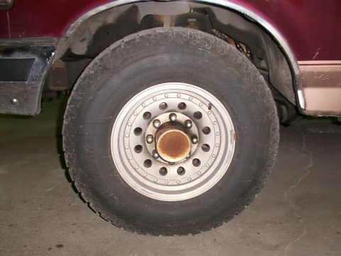 1988 Ford C-350 (Centurion Conversions) - Front wheel and fender detail of a truck, likely a Ford C-350 based on album context.