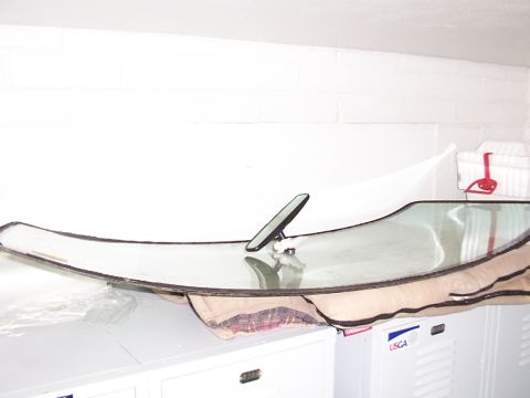 1988 Ford C-350 (Centurion Conversions) - Windshield and rearview mirror shown separately from a vehicle.