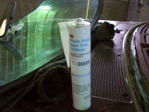 1988 Ford C-350 (Centurion Conversions) - Windshield sealant tube sits on dashboard near the glass. Part number -08609 visible.