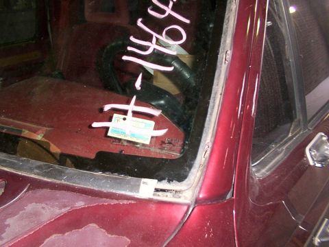 1988 Ford C-350 (Centurion Conversions) - Close-up of a vehicle's interior windshield area, marked with pink writing and a tag.
