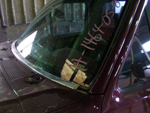 1988 Ford C-350 (Centurion Conversions) - Windshield interior view with writing and tape. The vehicle is not identifiable.