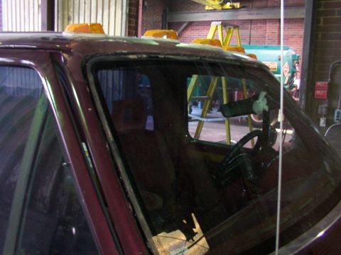 1988 Ford C-350 (Centurion Conversions) - Maroon truck cab with orange cab lights visible from the front interior view.