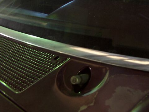 1988 Ford C-350 (Centurion Conversions) - The photo shows a close-up of a vehicle's windshield wiper mount and part of the grille.
