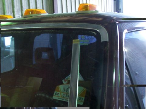 1988 Ford C-350 (Centurion Conversions) - The photo shows the interior of a truck, focusing on the windshield area and the roof with emergency lights.