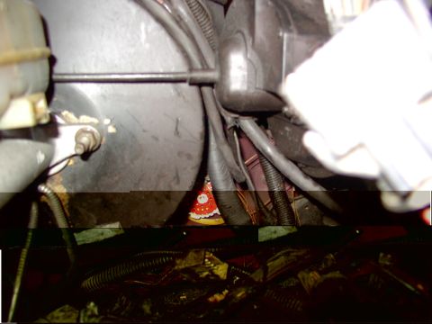 1988 Ford C-350 (Centurion Conversions) - Close-up view of the engine compartment wiring and brake booster assembly.