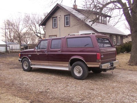 1988 Ford C-350 (Centurion Conversions) - This extended cab pickup truck is fitted with a camper shell, giving it a van-like appearance.