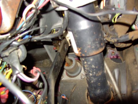 1988 Ford C-350 (Centurion Conversions) - A tangle of wires and components are visible in this interior shot of a vehicle's under-dash area.