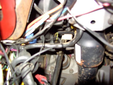 1988 Ford C-350 (Centurion Conversions) - A complex network of wires and connectors is visible within the vehicle's interior, suggesting a repair or diagnostic scenario.