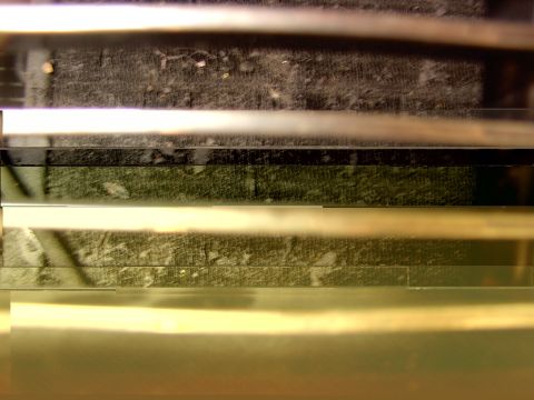 1988 Ford C-350 (Centurion Conversions) - Abstract image with horizontal lines and textured surfaces, not clearly identifiable as a vehicle.