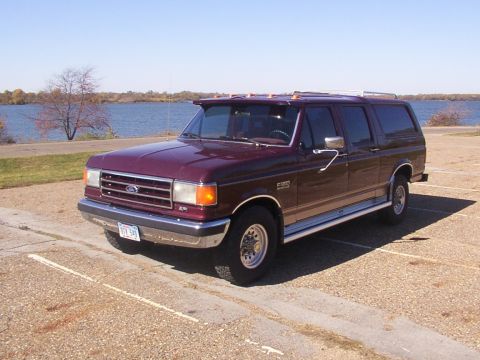 1988 Ford C-350 (Centurion Conversions) - This 1988 Ford C-350 Centurion Conversions SUV is seen parked near a body of water on a sunny day.