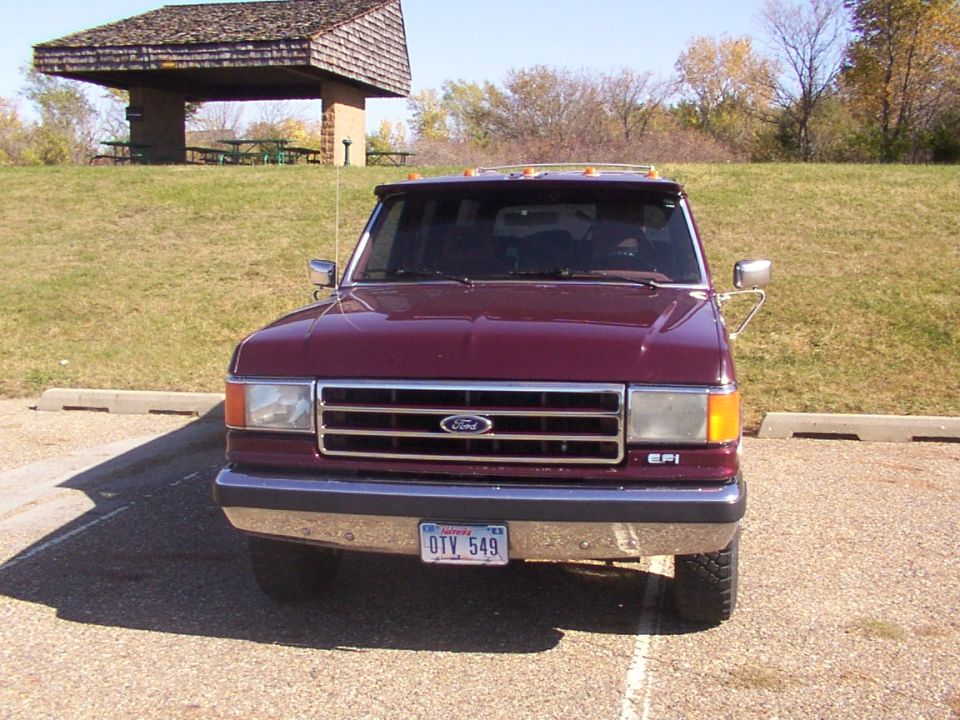 Maroon 1988 Ford C-350 (Centurion Conversions) front view with a license plate reading OTV 549
