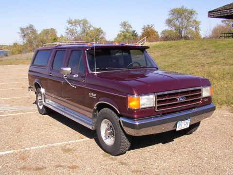 1988 Ford C-350 (Centurion Conversions) - Maroon Ford C-350 Centurion Conversion SUV, model year 1987, seen parked in an outdoor lot.