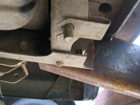 1974 Ford F-100 - Close-up view of a vehicle's rear bumper mounting bracket, with the word 'Right' written on it.