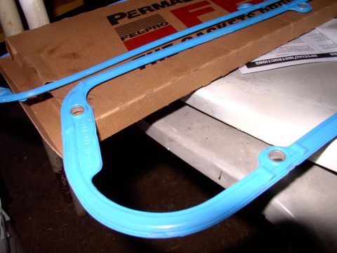 1990 Lincoln Town Car - The gasket closest to you is ready to go on, with the side that is facing up, to go against the valve cover. The farther away gasket is ups…