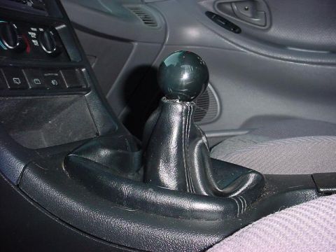 1994 Ford Probe - Interior view of a car's center console with a gear shift knob and boot.