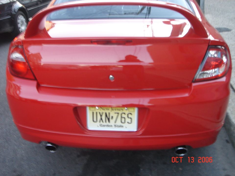 Red Dodge Neon SRT-4 rear view, New Jersey license plate UXN-76S, dual exhaust pipes