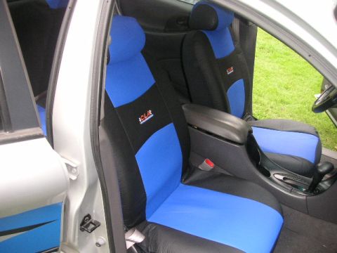 1999 Ford Taurus - Interior view of a car with custom blue and black seat covers installed.
