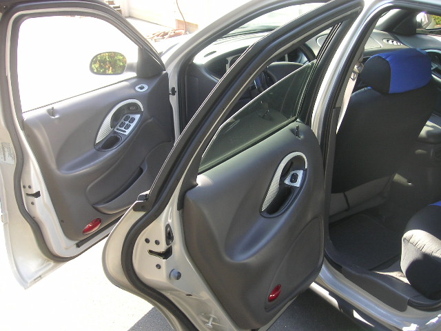 Interior door panel and seats of a 1999 Ford Taurus